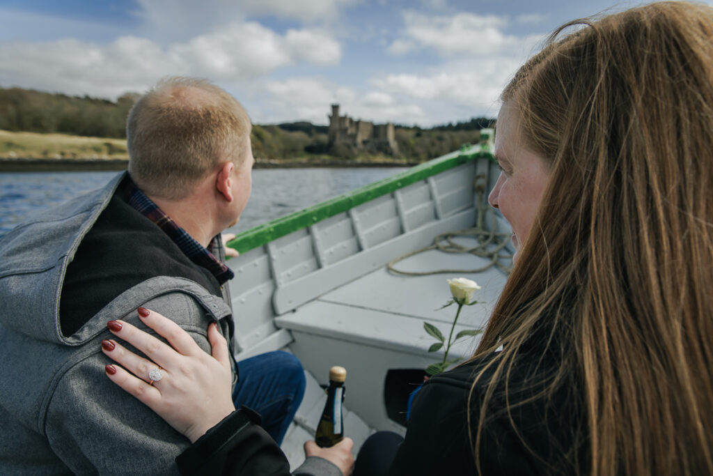 a newly engaged couple on a boat trip to celebrate getting engaged on teh Isle of Skye